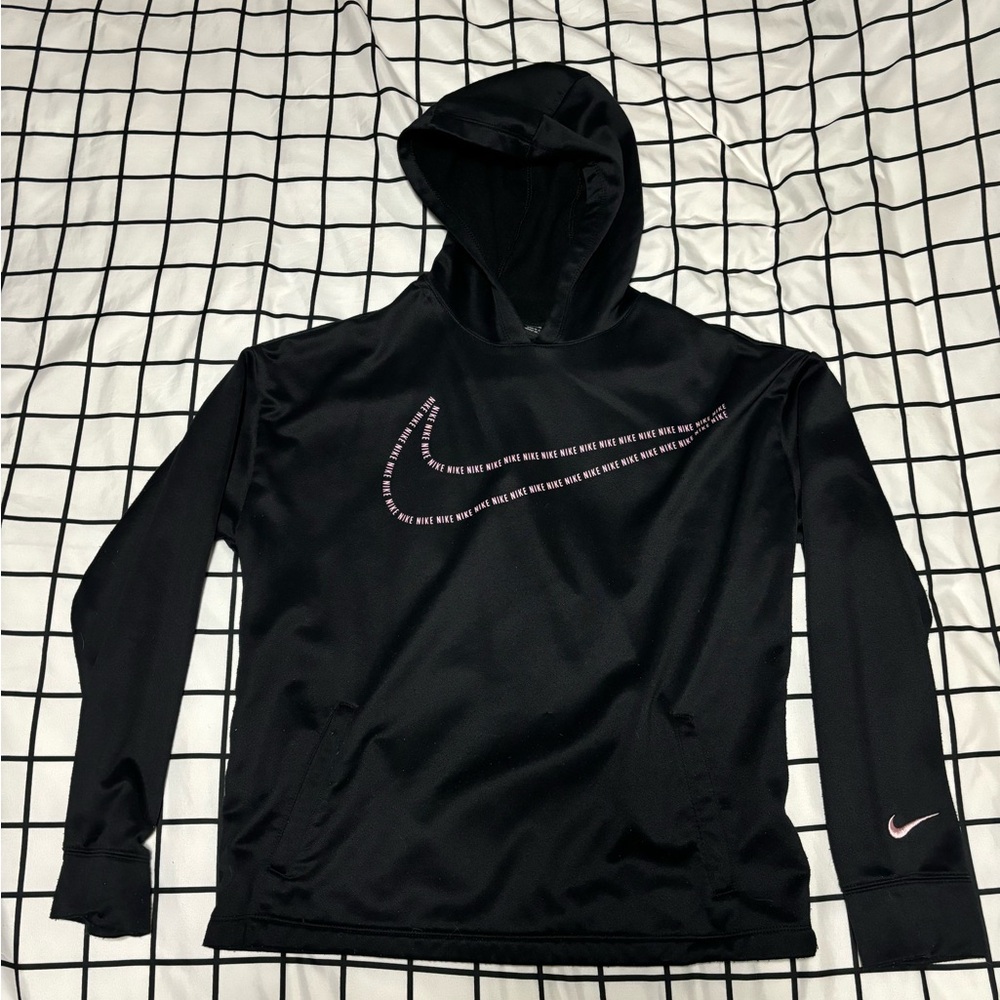 This is a black and pink Nike hoodie. It is a youth XL.